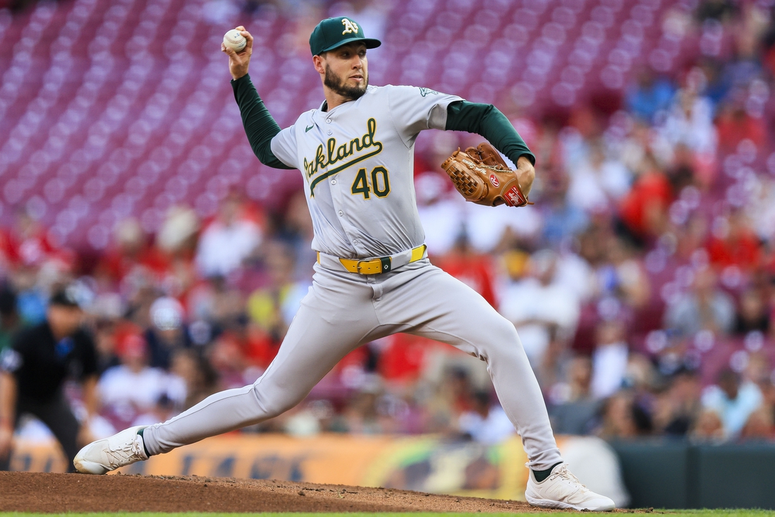 A’s go deep twice in 7th, narrowly fend off Reds