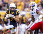 West Virginia comes from behind late to beat Kansas