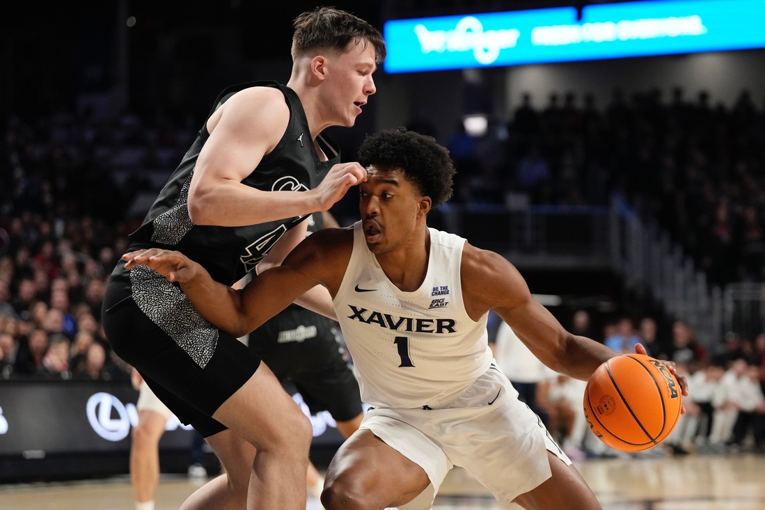 No. 22 Cincinnati roars back late to upend rival Xavier