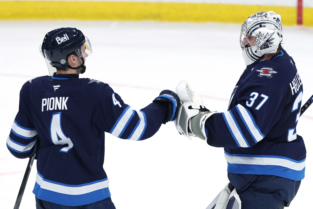 NHL roundup: Jets’ Connor Hellebuyck earns 300th win